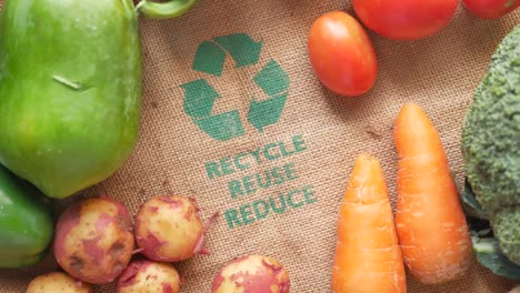 recycled arrows sign on a shopping bag with vegetable ,