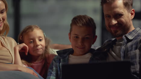 Happy-parents-and-kids-having-video-call-on-computer.-Family-spending-time-home