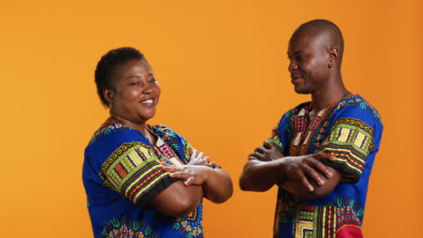 african american people in traditional apparel on camera