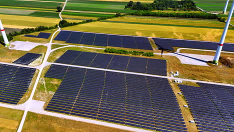 solar power field generates clean energy. vast solar panels cover the landscape in a renewable energy site, surrounded by agricultural fields and wind turbines