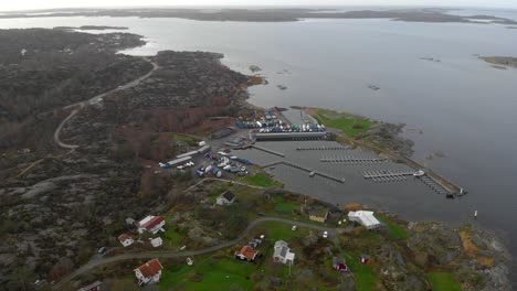 Aerial-view-of-remote-coastal-area-with-winterized-boats-and-calm-sea-water