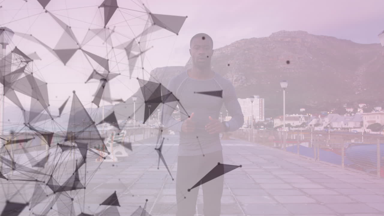 아프리카계 미국인  ⁇ 한 남자가 산책로에서 달리는 기하학적 모양의 애니메이션