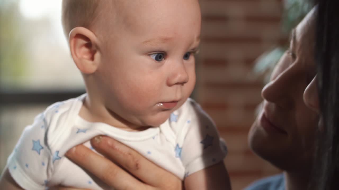 Adorable baby with parent