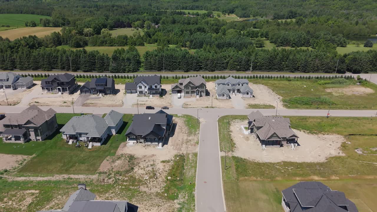 Aerial view of new houses in a development, calm suburban setting