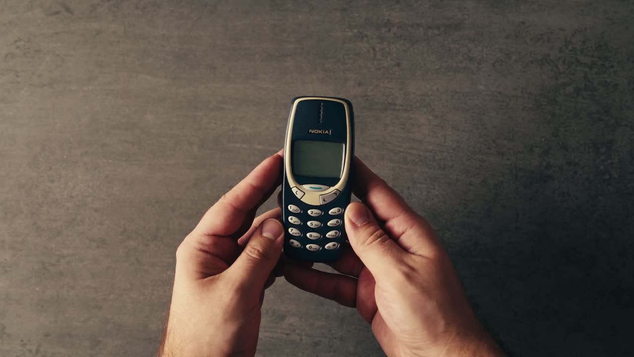 Vintage Nokia Mobile Phone in Hands