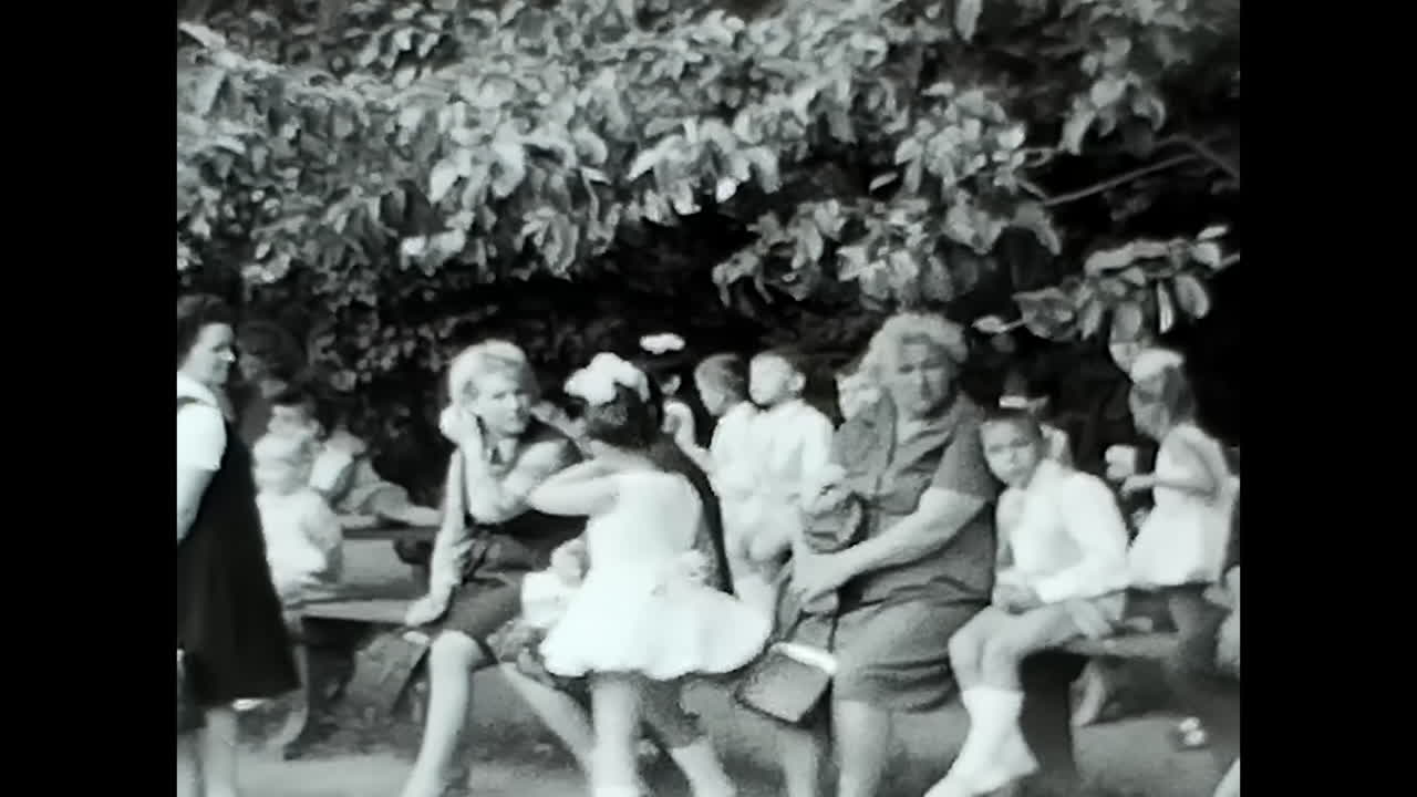 Group of People Standing in Front of a Building. CIRCA USSR 1970: A gathering of individuals in front of a building, showcasing the Soviet people during the era of USSR.