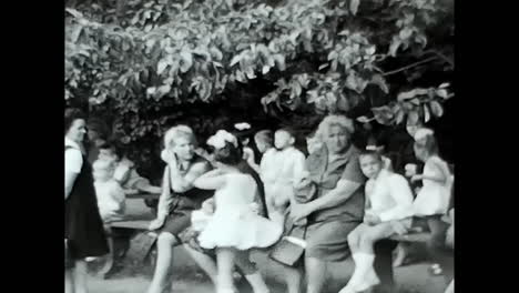 group of people standing in front of a building. circa ussr 1970: a gathering of individuals in front of a building, showcasing the soviet people during the era of ussr.