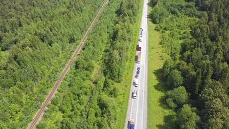 highway and train tracks through forest