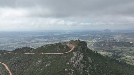 breathtaking view of a guard house on the top of a rocky hil