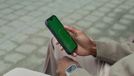 person using a smartphone outdoors