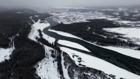 winter landscape of yukon river in whitehorse, canada - aerial drone shot