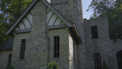 tilt-up-shot-to-reveal-to-towers-and-battlements-of-a-stone-castle