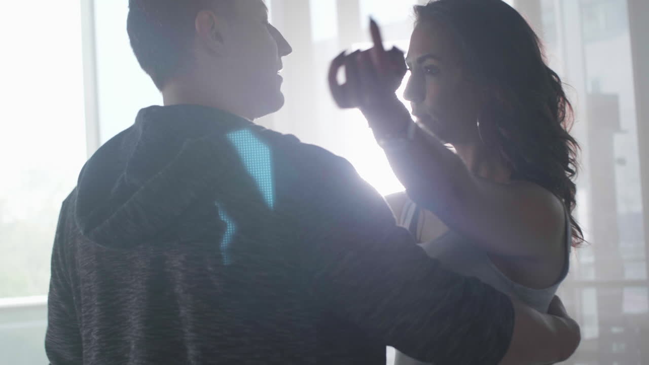 Romantic Couple Silhouetted in Soft Light