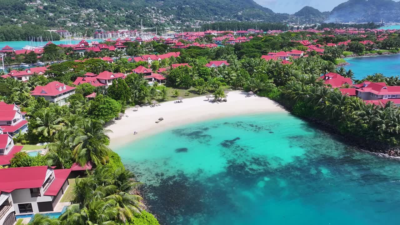 Aerial View of a Tropical Island Resort with Turquoise Waters and White Sand Beaches