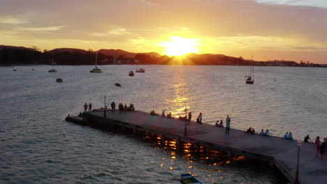 drone shot on buzios bay with boats and sunset