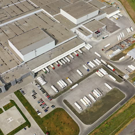 top view of a large industrial center with parking for trucks. aerial view on the modern manufacturing complex.