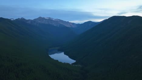 Flying-Over-The-Mountain-Range-With-Dense-Forest-And-Valley