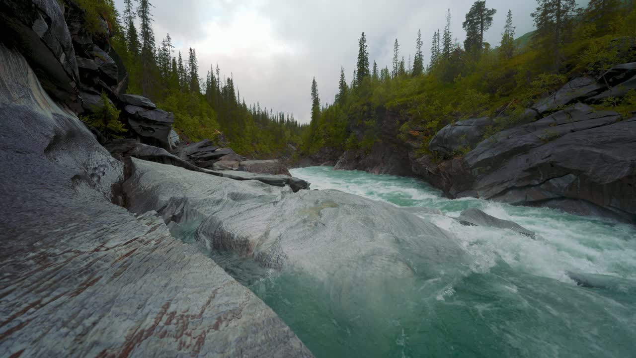 Mountain river Marmorslottet Marmorfossen in Mo I Rana, Northern Norway. Water carved Marble stone