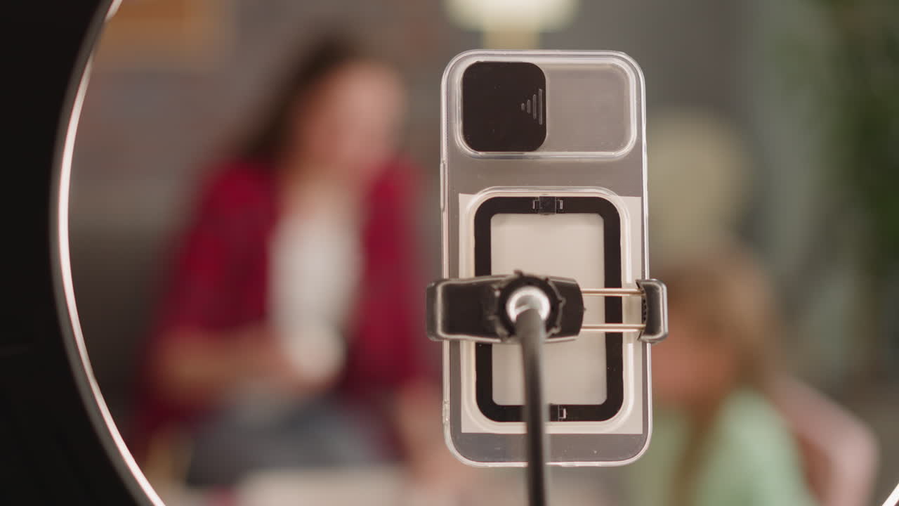 Blurry mother and daughter bloggers color eggs for Easter