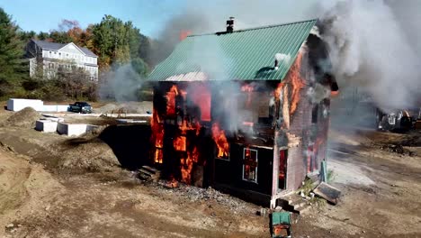 aerial view of a live fire training exercise with a fully involved house.