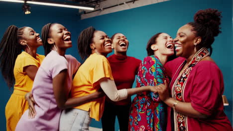 joyful diverse women laughing together in studio