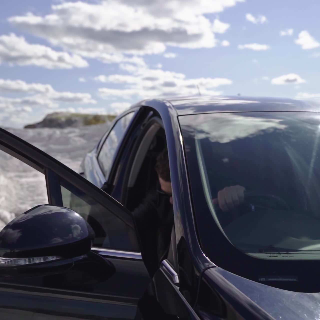 Handsome brutal man in car