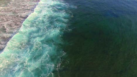 Flying-Over-Turquoise-Blue-Indonesian-Ocean