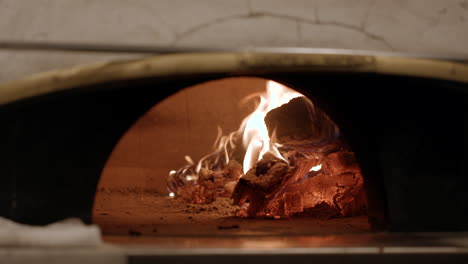 Wood-burns-in-a-neapolitan-style-pizza-oven-at-an-upscale-trendy-restaurant