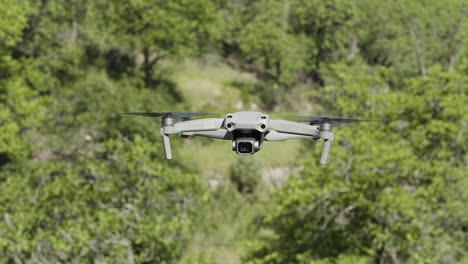 drone in flight over trees