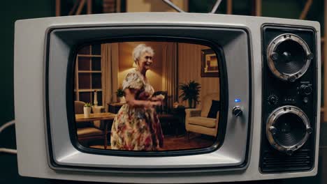 older woman dancing on retro tv