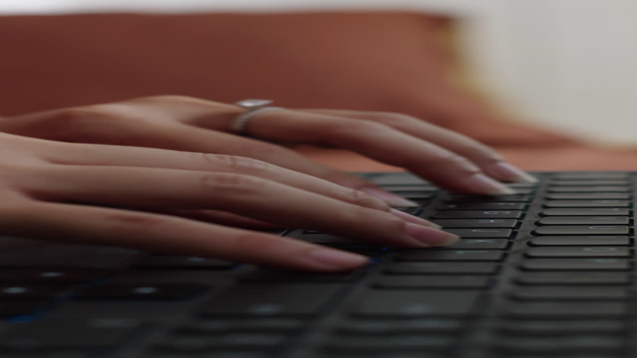 Hands of Worker Tapping on Keyboard