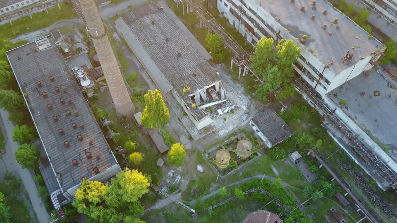 Abandoned Warehouses And Factories. Top view of the abandoned factory with broken windows and walls