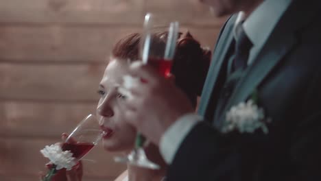 young man and his beautiful girl drink wine during dinner in a restaurant 3 close-up