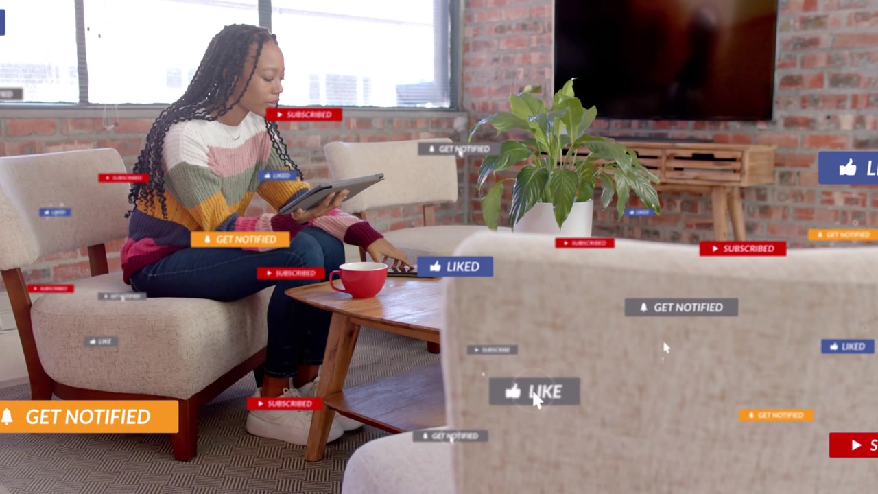Woman reviewing tablet, reaching for phone and engaging with floating LIKE prompts for marketing