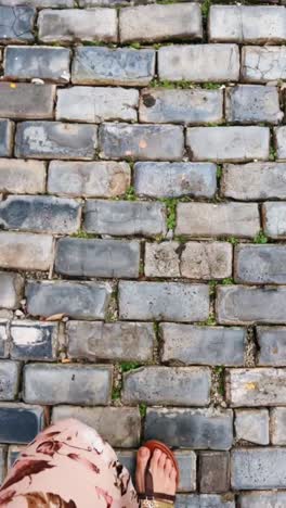 walking on a cobblestone street