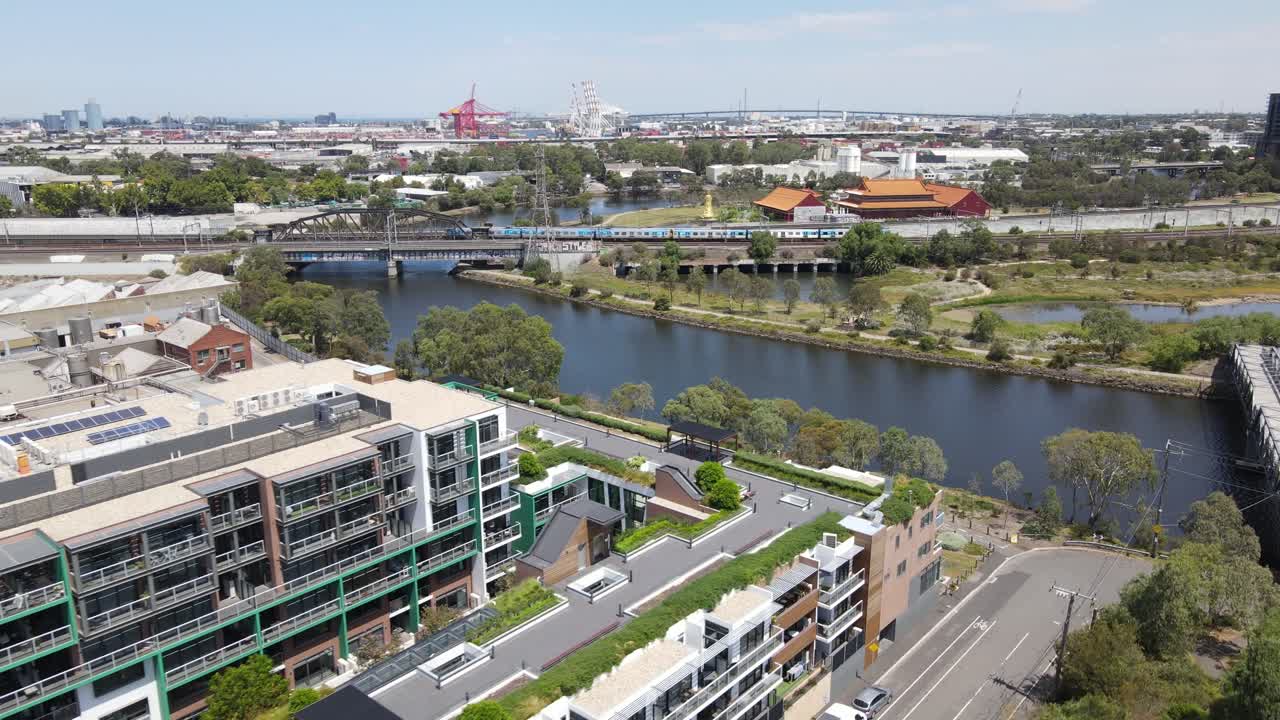 Aerial drone above Kensington and Footscray, showing Vline and Metro trains in Melbourne