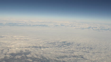 aerial view of clouds out of plane window shot in 4k high resolution