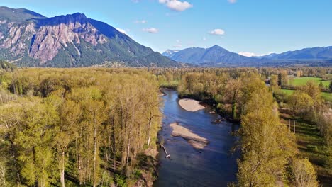 Scenic-aerial-shot-of-Snoqualmie-Middle-Fork-River-with-Mount-Si-in-the-background-in-North-Bend,-Washington-State