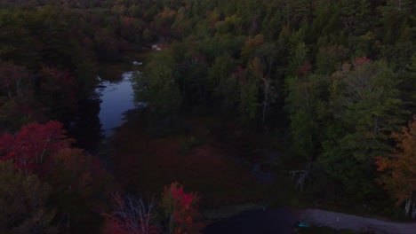 A-quick-downward-crane-shot-of-a-small-river-in-Maine