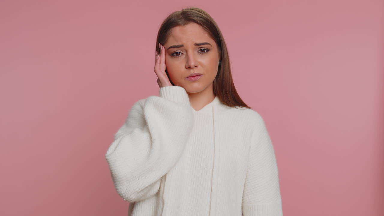 Woman rubbing temples to cure headache problem, suffering from tension and migaine, stress, pain