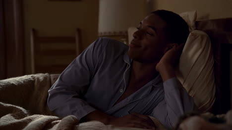 man in bed at night