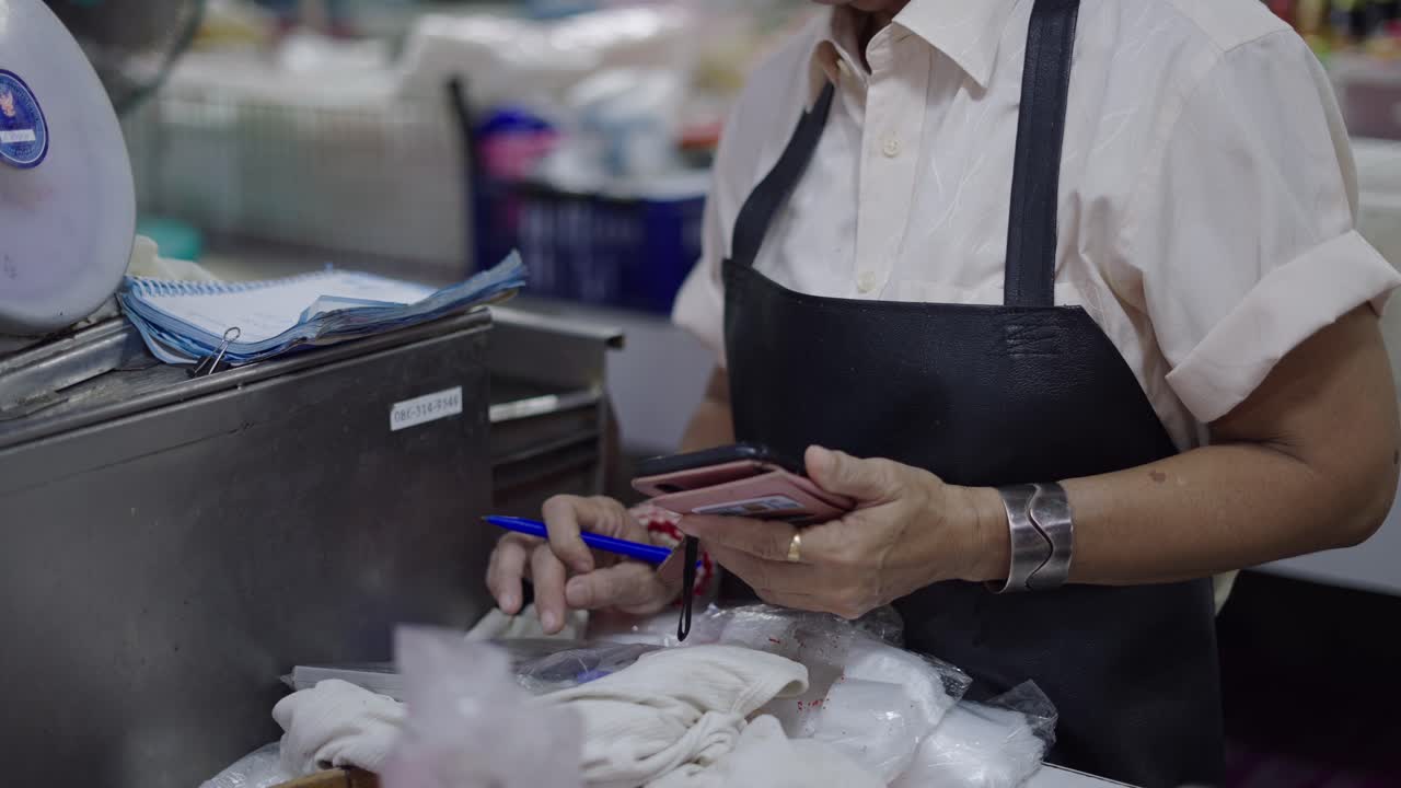 Woman working at a market stall