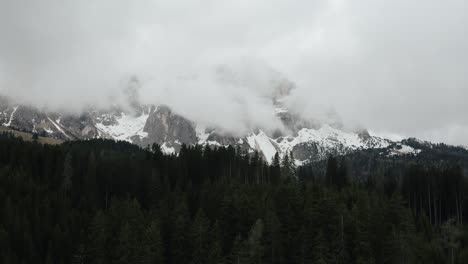 Drone-shot-of-forests-surrounding-Italy's-Dolomites