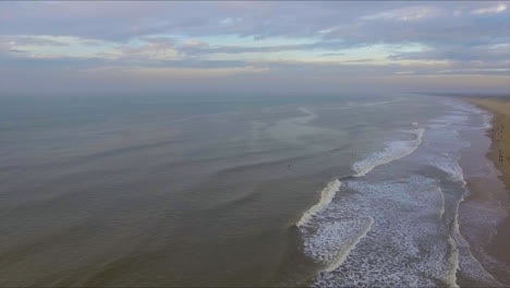 as the sun goes down, the sky and the sea merge in the far distance. this is the north sea, filmed at sunset on october 30 2016.