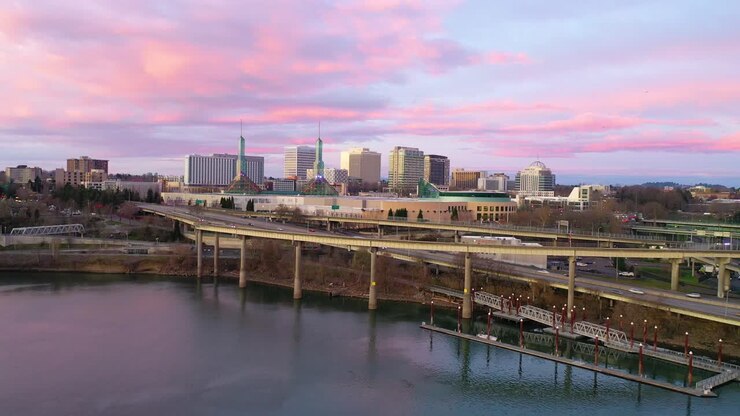 Very good dusk aerial of Willamette River Portland Convention Center towers and cityscape