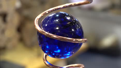 A-beautiful-blue-crystal-sphere-that-turns-forever