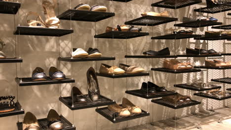 shelf of shoes in retail store at shopping mall