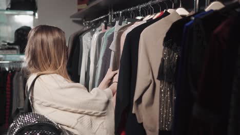 woman shopping for clothes in a fashion store