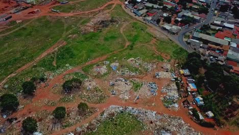 aerial view of an illegal dumpsite near a residential area