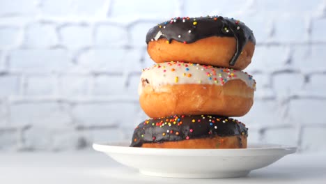 stacked donuts with chocolate and white icing